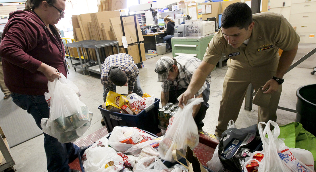 Us navy 111123 n hw977 185 sailors weigh thanksgiving food drive donations before delivery to the corona norco settlement house