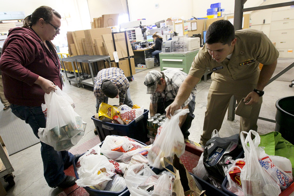 Us navy 111123 n hw977 185 sailors weigh thanksgiving food drive donations before delivery to the corona norco settlement house